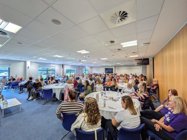 Conference Attendees sitting in main room